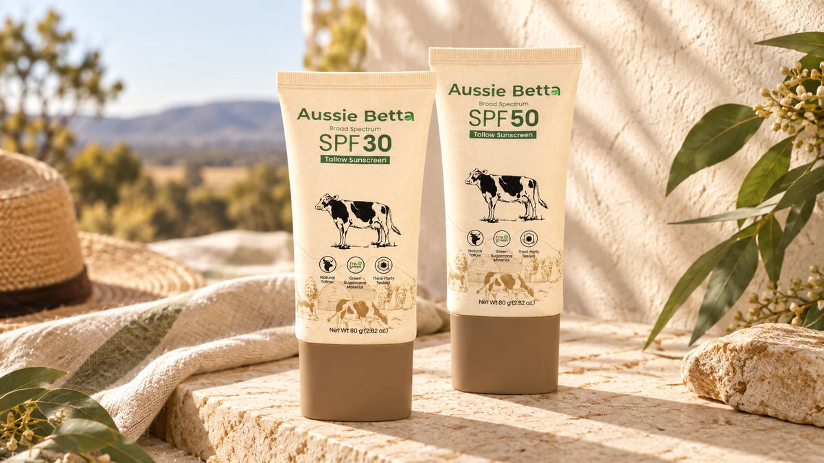 Aussie Betta SPF30 and SPF50 tallow sunscreens together in warm natural sunlight